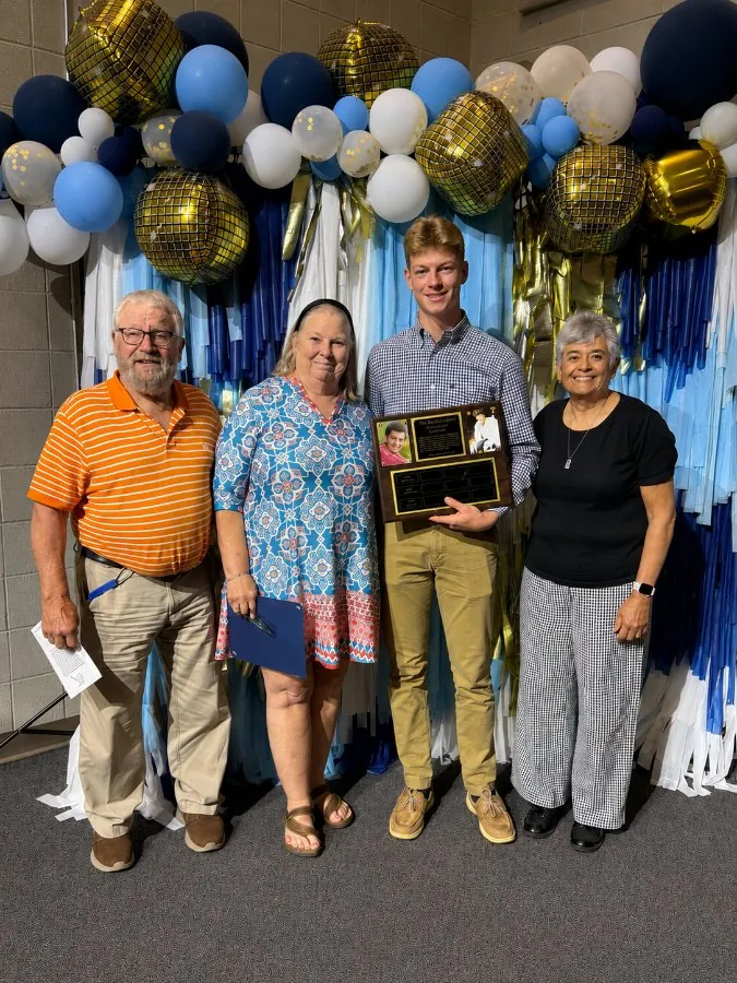 Luke Steinle receiving the 2026 Live Wide Open scholarship at Walker Valley High School